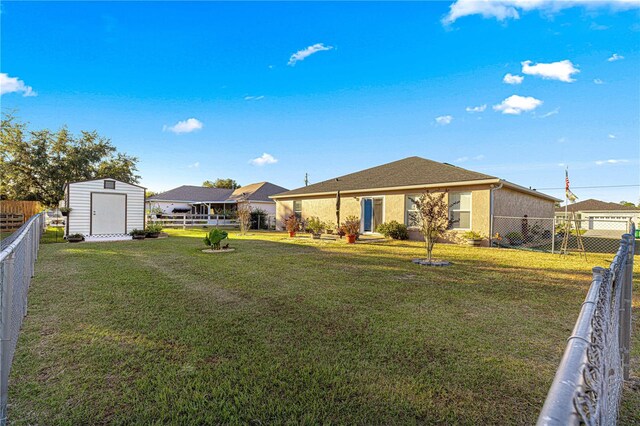 exterior space featuring a yard and a storage unit