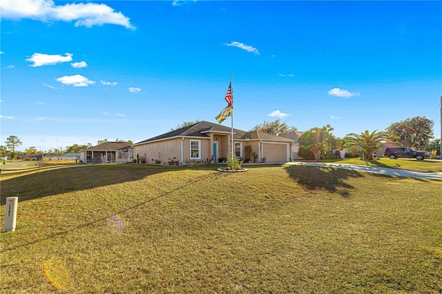 single story home featuring a garage and a front lawn