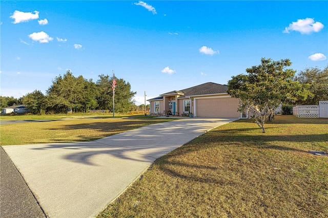 view of front of home featuring a front yard and a garage