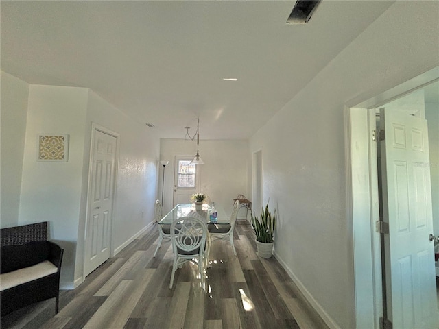 corridor with dark wood-type flooring