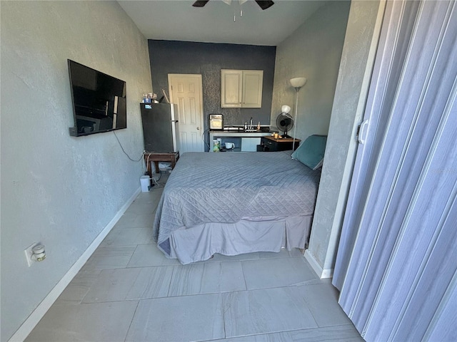 tiled bedroom featuring ceiling fan