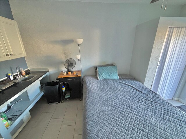 tiled bedroom with sink