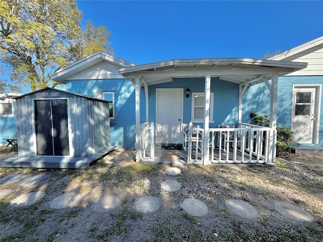 view of front of house featuring a storage shed