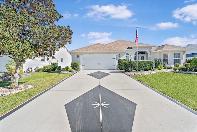 view of front of property with a front yard and a garage