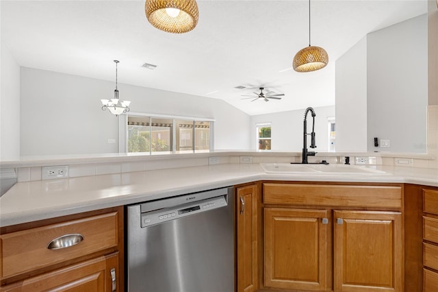 kitchen featuring stainless steel dishwasher, ceiling fan with notable chandelier, sink, decorative light fixtures, and lofted ceiling