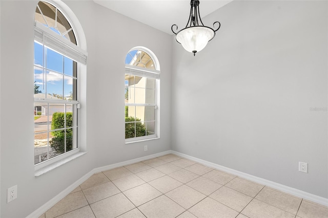 unfurnished dining area with a wealth of natural light and light tile patterned floors