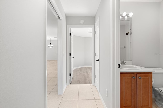 bathroom with tile patterned floors, vanity, and toilet