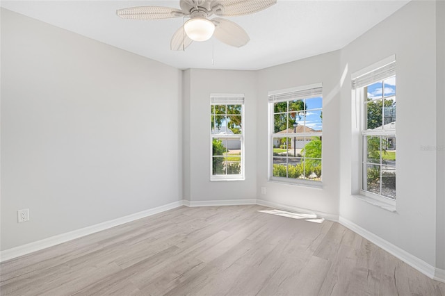 unfurnished room with ceiling fan and light hardwood / wood-style floors