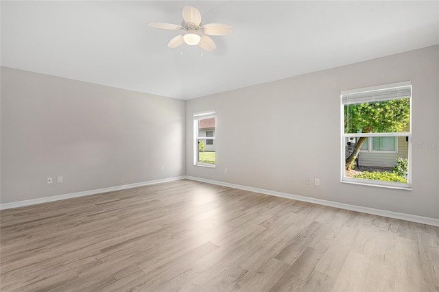 empty room featuring ceiling fan and light wood-type flooring