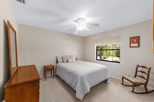 bedroom with light colored carpet and ceiling fan