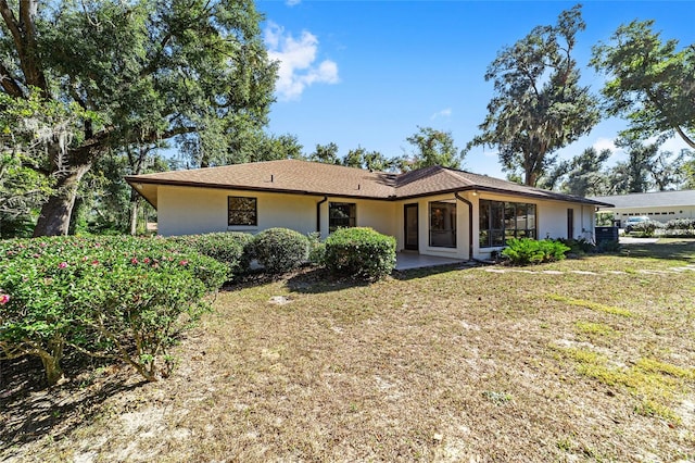 ranch-style house with a front lawn