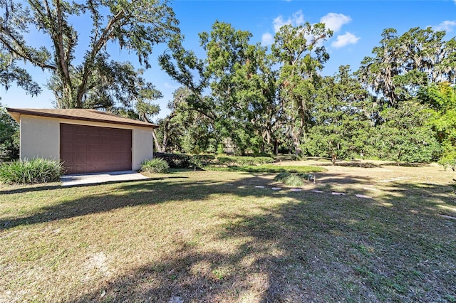 view of yard featuring a garage