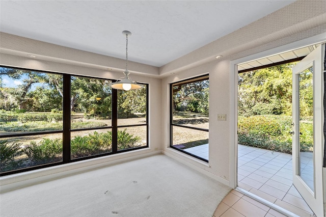 unfurnished sunroom with a wealth of natural light