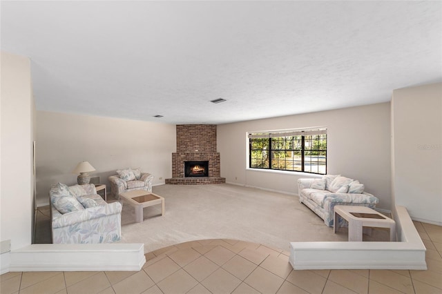 carpeted living room featuring a brick fireplace