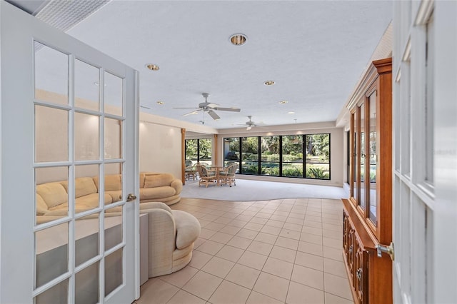 living room featuring light colored carpet and ceiling fan