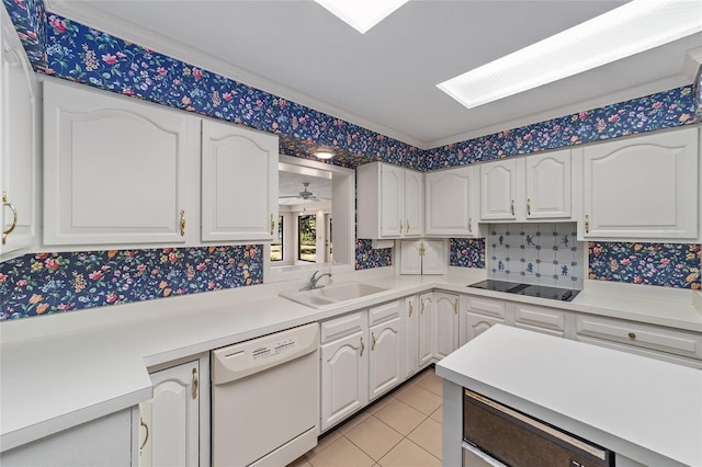 kitchen featuring black electric cooktop, dishwasher, white cabinets, and sink