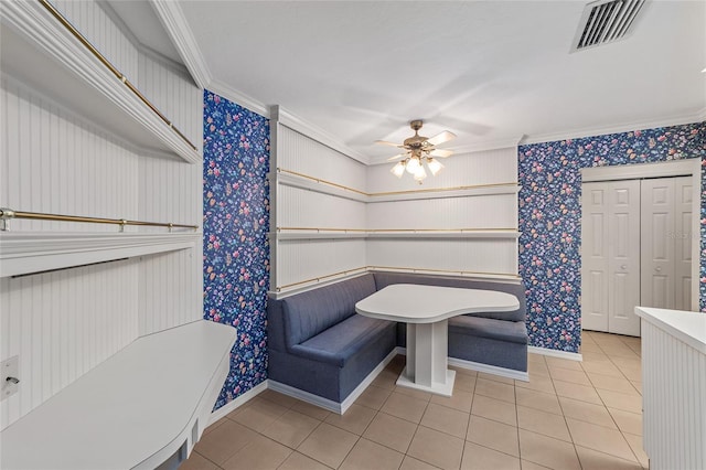 bathroom featuring breakfast area, tile patterned floors, ceiling fan, and crown molding