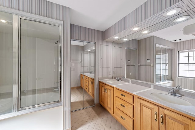 bathroom with tile patterned flooring and vanity