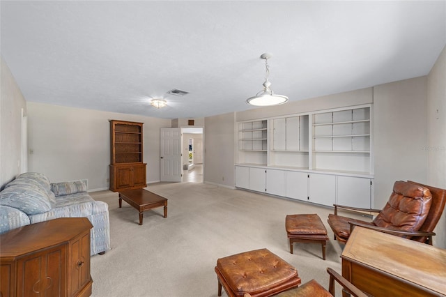 carpeted living room with built in shelves