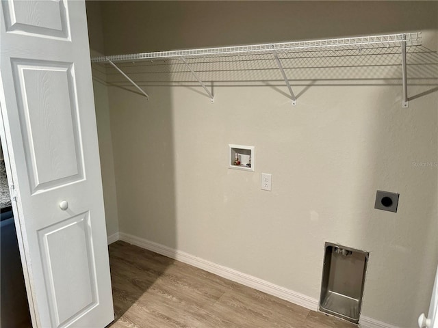 laundry area with electric dryer hookup, washer hookup, and light wood-type flooring