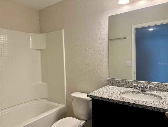 full bathroom with shower / bathing tub combination, vanity, and toilet