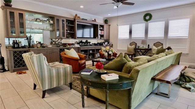 tiled living room featuring ceiling fan, ornamental molding, and sink