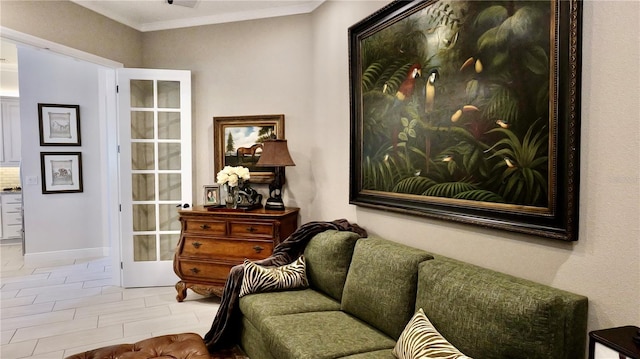 living area featuring crown molding