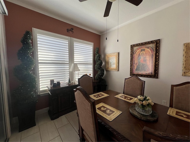 dining space with ceiling fan, plenty of natural light, light tile patterned floors, and ornamental molding