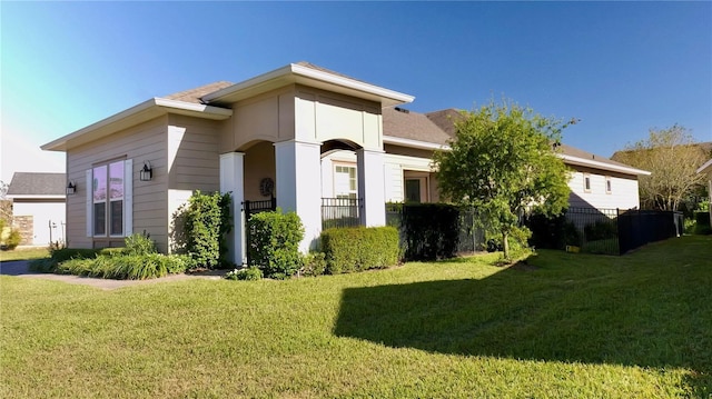 view of property exterior featuring a lawn