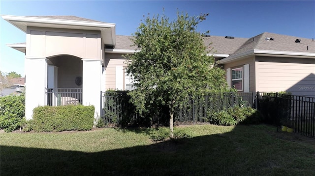 back of house with a yard