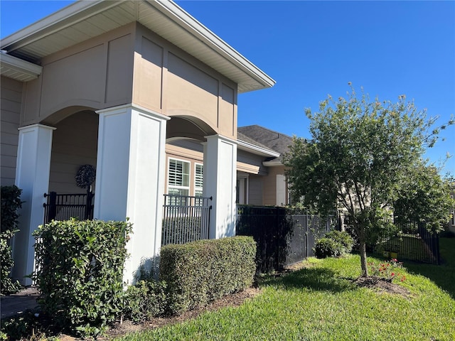 view of side of property featuring a yard