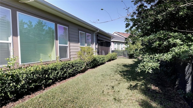 view of home's exterior with a yard