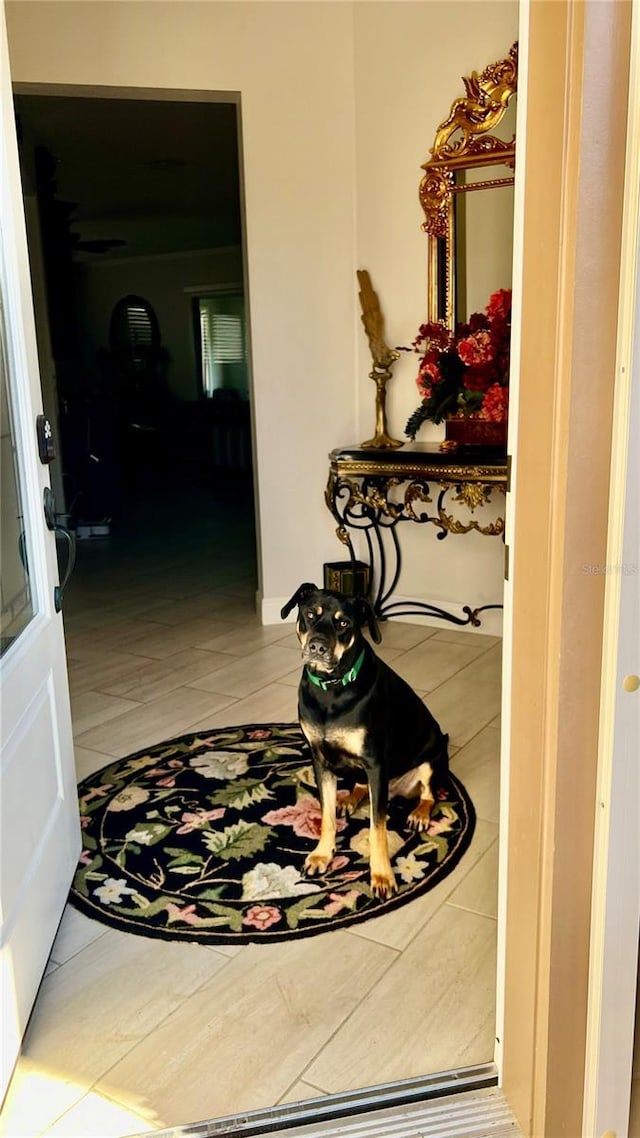 hall with tile patterned flooring