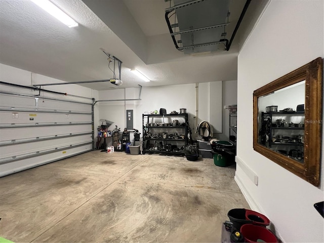 garage with electric panel and a garage door opener