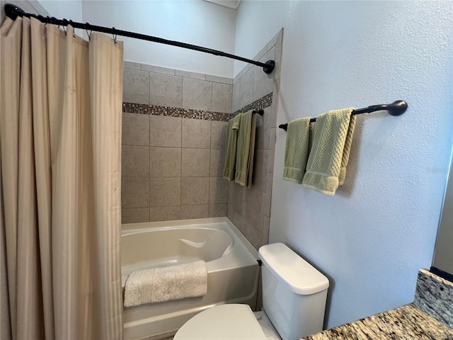 bathroom with toilet and shower / bathtub combination with curtain