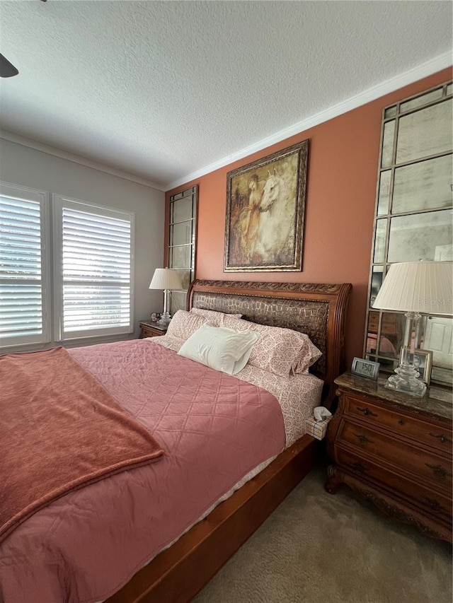 carpeted bedroom featuring a textured ceiling and crown molding