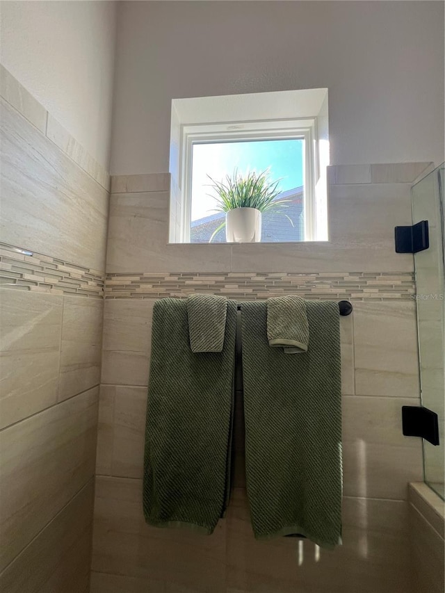 bathroom with a tile shower