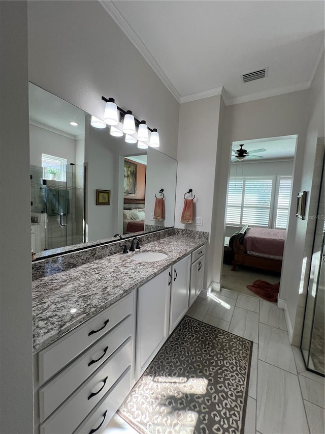 bathroom featuring vanity, a wealth of natural light, a shower with door, and ceiling fan