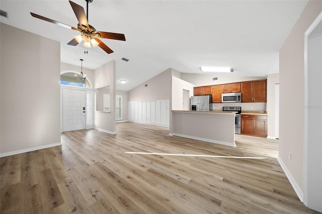 unfurnished living room with ceiling fan, vaulted ceiling, and light wood-type flooring