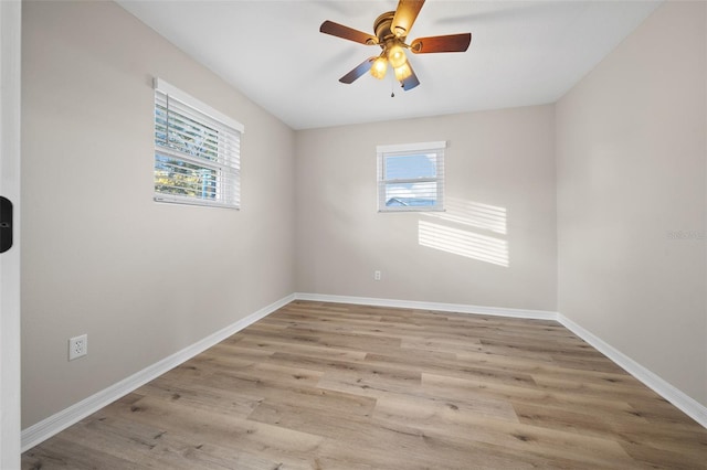 empty room featuring ceiling fan and light hardwood / wood-style flooring