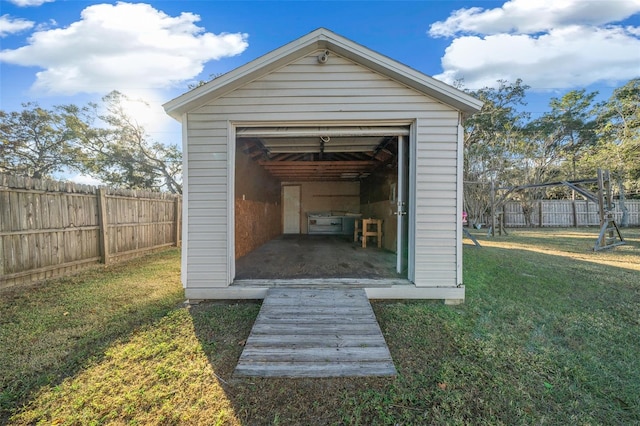 view of outbuilding with a yard