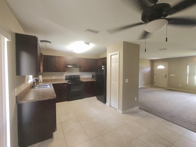 kitchen featuring ceiling fan, sink, light carpet, dark brown cabinets, and black appliances