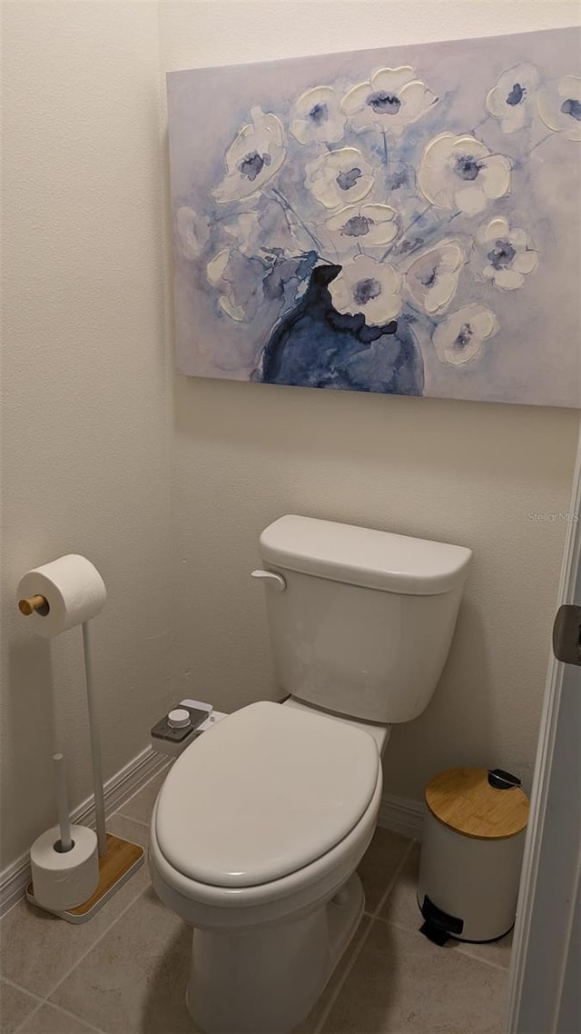 bathroom featuring tile patterned floors and toilet