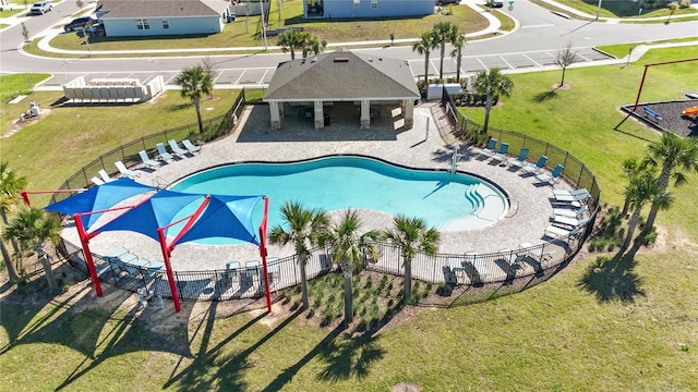 view of pool featuring fence