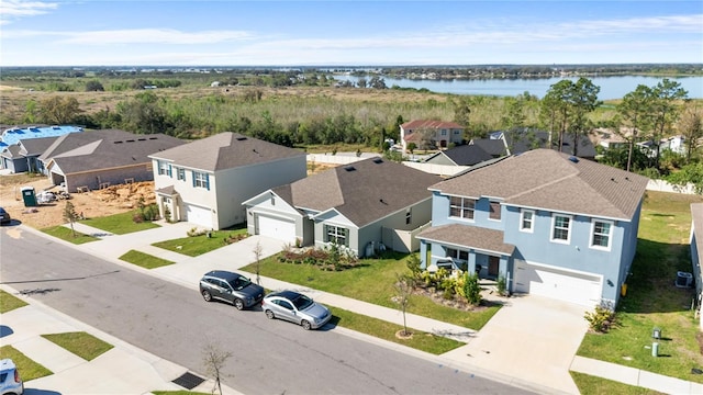 aerial view featuring a water view and a residential view