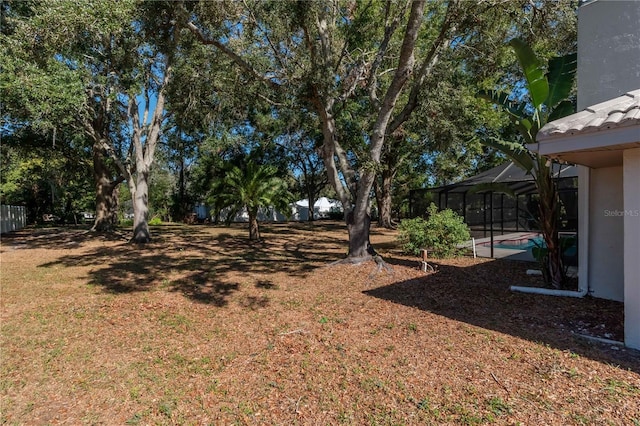 view of yard featuring a lanai