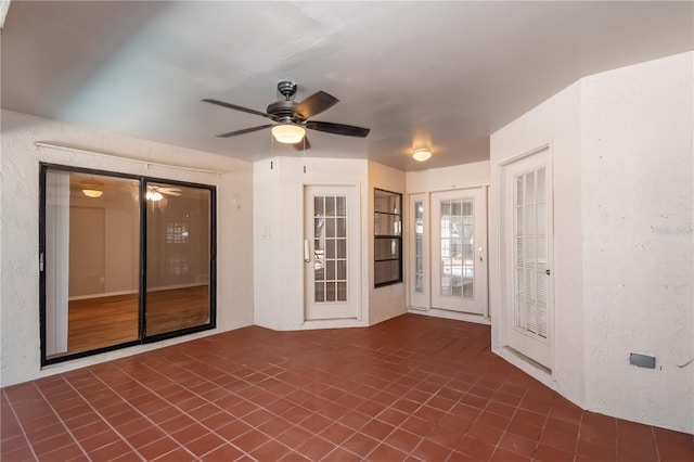 spare room with ceiling fan