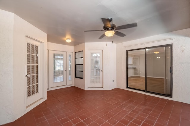 interior space featuring ceiling fan