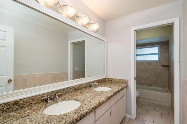 bathroom featuring tile patterned flooring, vanity, and toilet