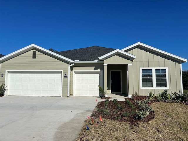 ranch-style home featuring a garage